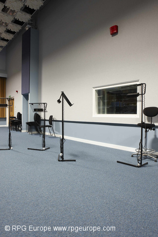 RAF Northolt
In the main rehearsal room, the RPG product range included: Skylines suspended from the ceiling, Modffusors, Absorbers and stretch fabric on the walls. AcousticGRG Northolt 18June10 24.jpg