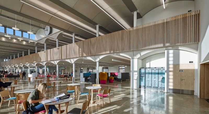 Our team designed and manufactured a range of acoustic products to compliment the design of the new Pavilion building and lecture theatres and classrooms at the newly built Clifton Campus at Nottingham Trent University.
Pavilion Building:
Our team custom made Ash slatted acoustic timber balustrade on a modular wood frame system in-corporating Absorber panels covered in Camira fabric to form bespoke panelling, which was then installed by our team.
For the upper work seating area in the Pavilion, RPG Absorber panels in Camira fabric were custom made and fitted with magnet fittings with Z bars to clear cable trays on all the high level metal beams and installed by our team.
Photos by Adam Coupe Photography NTP6.jpg
