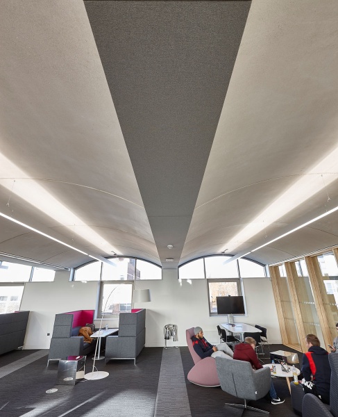 Our team designed and manufactured a range of acoustic products to compliment the design of the new Pavilion building and lecture theatres and classrooms at the newly built Clifton Campus at Nottingham Trent University.
Pavilion Building:
For the upper work seating area in the Pavilion, RPG Absorber panels in Camira fabric were custom made and fitted with magnet fittings with Z bars to clear cable trays on all the high level metal beams and installed by our team.
Photos by Adam Coupe Photography NTC8.jpg