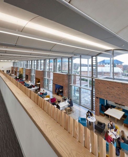 Our team designed and manufactured a range of acoustic products to compliment the design of the new Pavilion building and lecture theatres and classrooms at the newly built Clifton Campus at Nottingham Trent University.
Pavilion Building:
Our team custom made Ash slatted acoustic timber balustrade on a modular wood frame system in-corporating Absorber panels covered in Camira fabric to form bespoke panelling, which was then installed by our team.
For the upper work seating area in the Pavilion, RPG Absorber panels in Camira fabric were custom made and fitted with magnet fittings with Z bars to clear cable trays on all the high level metal beams and installed by our team.
Photos by Adam Coupe Photography NTC16.jpg