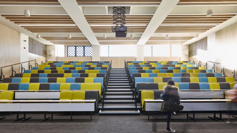 Our team designed and manufactured a range of acoustic products to compliment the design of the new Pavilion building and lecture theatres and classrooms at the newly built Clifton Campus at Nottingham Trent University.
Main Lecture Theatres No. 1,2,& 3:
Lambri acoustic timber slotted panelling in Blond Ash finish was installed on the walls incorporating vent grills, with custom made ceiling fins consisting of Lambri Blond Ash over acoustic absorption.
Photos: Adam Coupe Photography NTH26.jpg