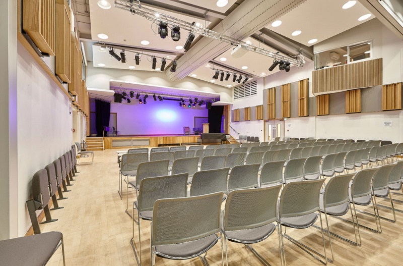 A selection of our acoustic wood products were specified for the new performing arts centre at Putney High School and installed by our team.
For the side walls, we installed our Soundtrac stretch system with Cara fabric, and fitted bespoke QRD panels finished in Oak on brackets to make them reversible, allowing the user to vary the acoustics of the room.
The upper level balconies are clad in our new modular timber panels, 25mm fabric covered panels with real oak strips mounted on the face, factory finished for quick site installation.
The stage has Oak Diffractals on the side walls, mounted in series to give a seamless appearance to the array.
Photos: Adam Coupe Photography 1.jpg