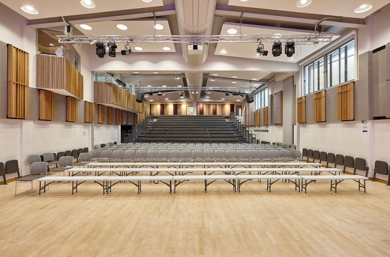 A selection of our acoustic wood products were specified for the new performing arts centre at Putney High School and installed by our team.
For the side walls, we installed our Soundtrac stretch system with Cara fabric, and fitted bespoke QRD panels finished in Oak on brackets to make them reversible, allowing the user to vary the acoustics of the room.
The upper level balconies are clad in our new modular timber panels, 25mm fabric covered panels with real oak strips mounted on the face, factory finished for quick site installation.
The rear wall behind the seating features fabric wrapped panels, finished in the clients own choice of fabric.
Photos: Adam Coupe Photography 2.jpg