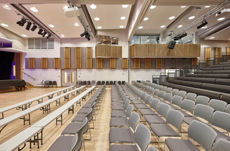 A selection of our acoustic wood products were specified for the new performing arts centre at Putney High School and installed by our team.
For the side walls, we installed our Soundtrac stretch system with Cara fabric, and fitted bespoke QRD panels finished in Oak on brackets to make them reversible, allowing the user to vary the acoustics of the room.
Photos: Adam Coupe Photography 3.jpg