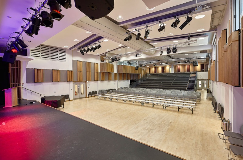 A selection of our acoustic wood products were specified for the new performing arts centre at Putney High School and installed by our team.
For the side walls, we installed our Soundtrac stretch system with Cara fabric, and fitted bespoke QRD panels finished in Oak on brackets to make them reversible, allowing the user to vary the acoustics of the room.
The upper level balconies are clad in our new modular timber panels, 25mm fabric covered panels with real oak strips mounted on the face, factory finished for quick site installation.
The rear wall behind the seating features fabric wrapped panels, finished in the clients own choice of fabric.
Photos: Adam Coupe Photography 5.jpg